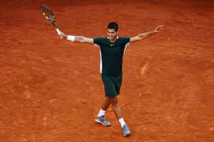 Rising Tennis Star Carlos Alcaraz In Action At French Open Wallpaper