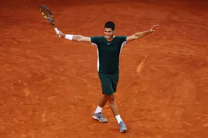 Rising Tennis Star Carlos Alcaraz In Action At French Open Wallpaper