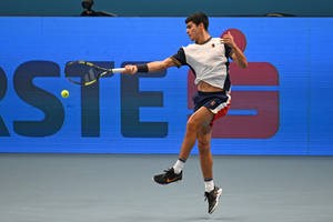 Rising Tennis Star Carlos Alcaraz In Action Wallpaper