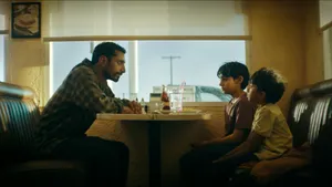 Riz Ahmed Diner Scene Wallpaper