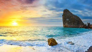 Rock Formation On Blue Beach Sunrise Wallpaper