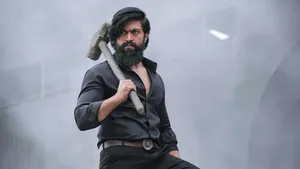 Rocking Star Yash With Hammer Wallpaper