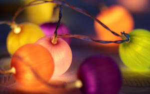 Round And Colorful Christmas Light Bulbs Wallpaper