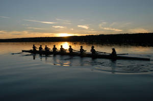 Rowing Silhouette In Sunset Wallpaper