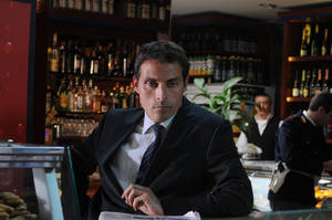 Rufus Sewell As Aurelio Zen In A Bar Wallpaper