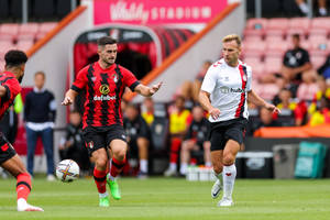 Running Afc Bournemouth Football Player Wallpaper