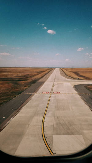 Runway With Yellow Long Lines Wallpaper