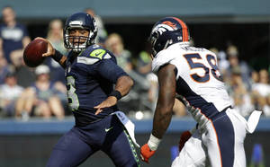 Russell Wilson In Action Wallpaper