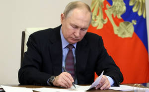 Russian President Vladimir Putin Signing Official Documents Wallpaper