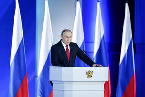 Russian President Vladimir Putin Standing Proudly Before Five Flags Wallpaper