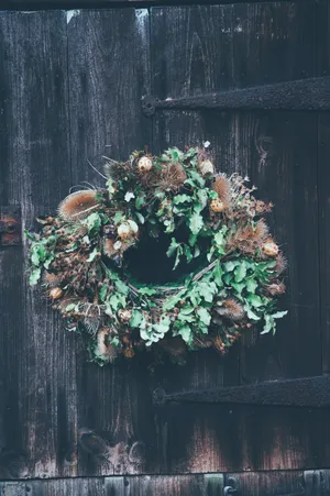 Rustic Christmas Wreath Adding Charm To The Holiday Ambiance Wallpaper