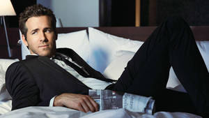 Ryan Reynolds Suit On Bed Wallpaper