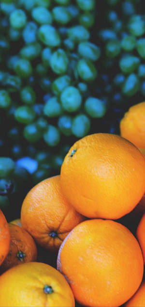 S10 Oranges And Grapes Wallpaper