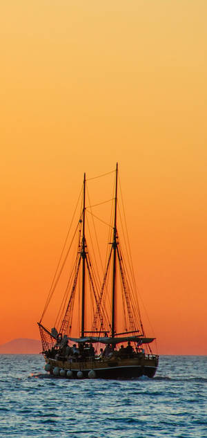 S10 Sailboat Orange Sky Wallpaper