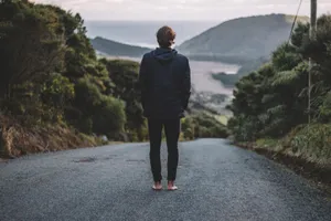 Sad Alone Man Standing On Road Wallpaper