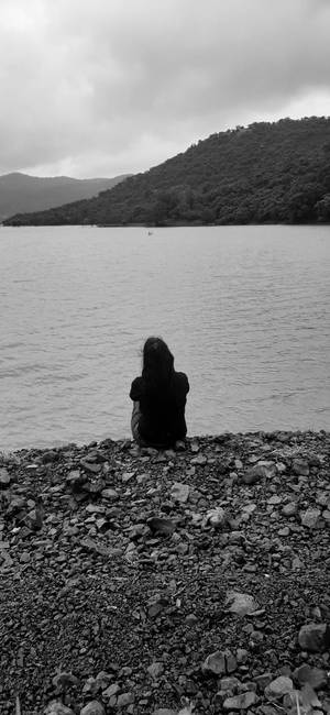Sad Girl Sitting Alone Wallpaper