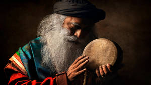 Sadhguru Holding A Kanjira Wallpaper