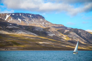 Sailing Boat Against Snow-capped Mountain Wallpaper