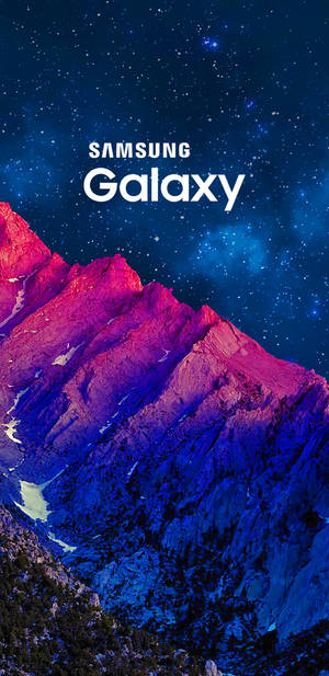 Samsung Galaxy J6 Illuminating The Twilight Mountain Peaks Wallpaper