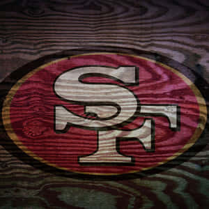 San Francisco 49ers Logo On A Wooden Background Wallpaper