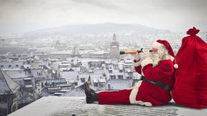 Santa Claus On Rooftop Wallpaper