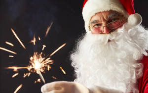 Santa Claus With Firework Stick Wallpaper