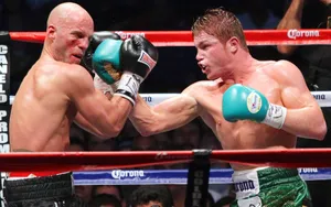 Saul Canelo Alvarez Landing A Powerful Punch Wallpaper