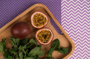 Savor The Exotic - A Freshly Sliced Passion Fruit Wallpaper