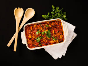 Savory Tray Of Moussaka On A Dark Surface Wallpaper