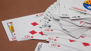 Scattered Deck Of Rummy Playing Cards Wallpaper