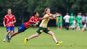 School Girls Playing Ultimate Frisbee Wallpaper