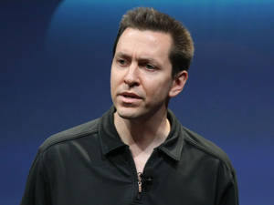 Scott Forstall Looking Thoughtful In A Presentation Wallpaper