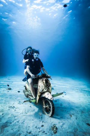 Scuba Diving And Riding Motorcycle Underwater Wallpaper