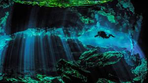 Scuba Diving Cave Light Rays Wallpaper