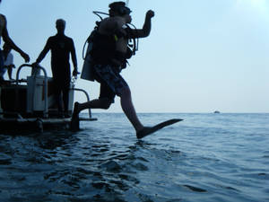 Scuba Diving Jumping Into Sea Wallpaper