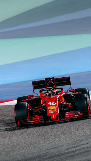 Scuderia Ferrari Races Ahead On The Track Wallpaper