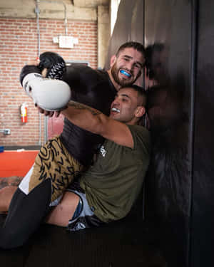 Sean Brady Hugging Friend Wallpaper