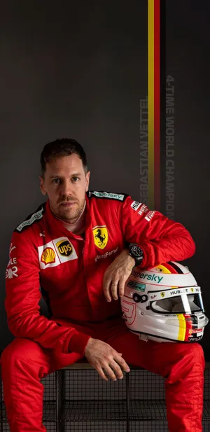Sebastian Vettel Leaning On His Helmet Wallpaper