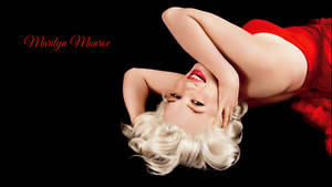 Seductive Marilyn Monroe In Red Dress Wallpaper