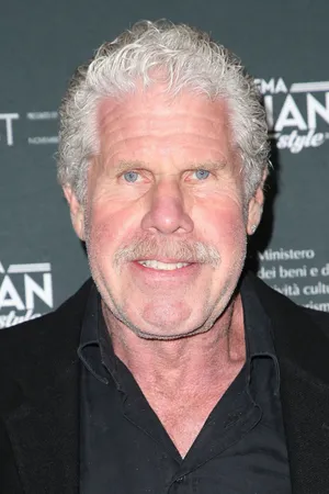 Senior Ron Perlman In Black Wallpaper