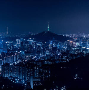Seoul City At Night With Lights On The Hill Wallpaper