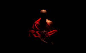 Serene Monk In Meditation Wallpaper
