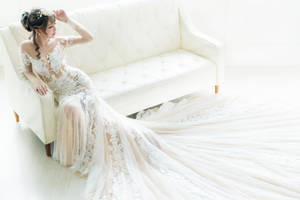 Sexy Bride On White Couch Wallpaper