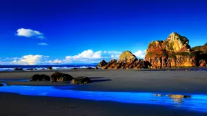 Shallow Beach With Rocks Wallpaper
