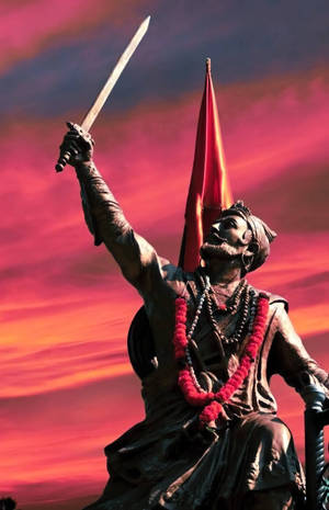 Shivaji Maharaj Holding Sword Up In Air Wallpaper