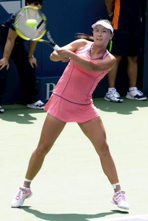 Shuai Peng In Pink Tennis Dress Wallpaper