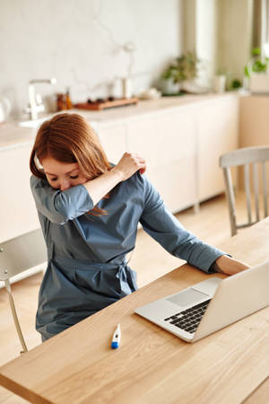 Sick Woman Using Elbow Sneeze Wallpaper