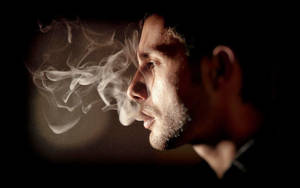 Side Profile Boy Smoke Blurry Backdrop Wallpaper