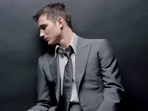 Side View Of Man In Suit Wallpaper