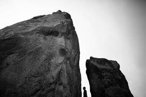 Silhouette Man On The Rocks Wallpaper